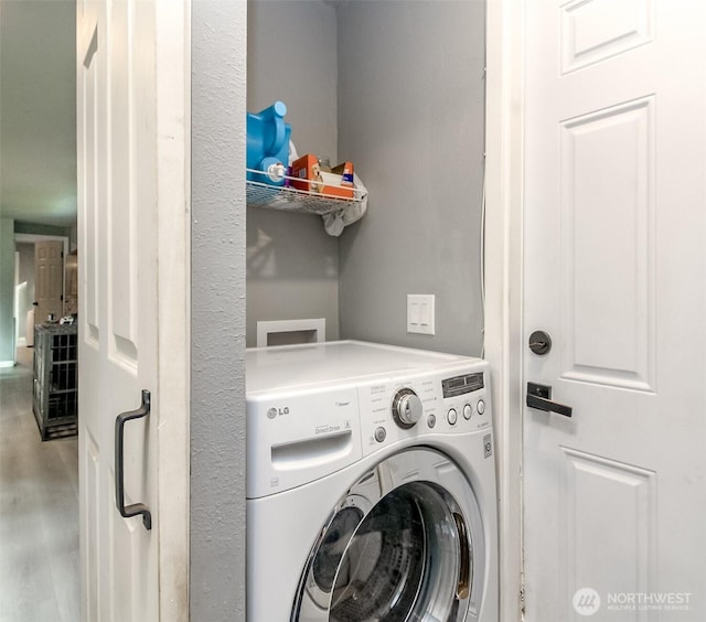 19820 63rd Avenue Ct E, Spanaway, WA 98387 - laundry area featuring washer / dryer and wood finished floors