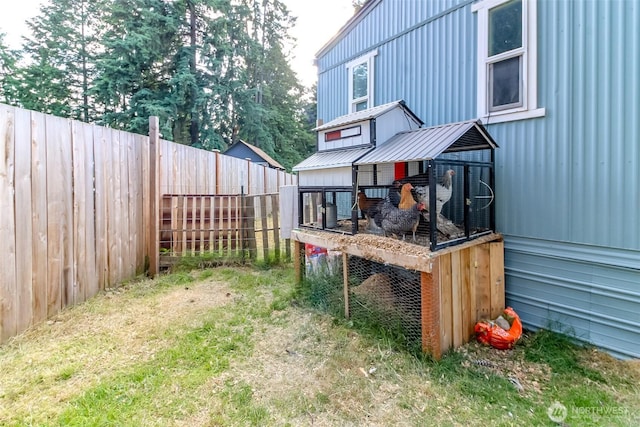 19820 63rd Avenue Ct E, Spanaway, WA 98387 - fenced backyard featuring exterior structure and an outbuilding