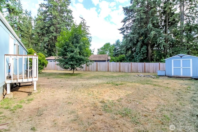 19820 63rd Avenue Ct E, Spanaway, WA 98387 - fenced backyard featuring a storage shed and a wooden deck