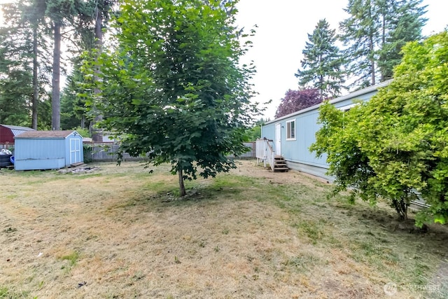 19820 63rd Avenue Ct E, Spanaway, WA 98387 - view of yard with a storage unit and entry steps