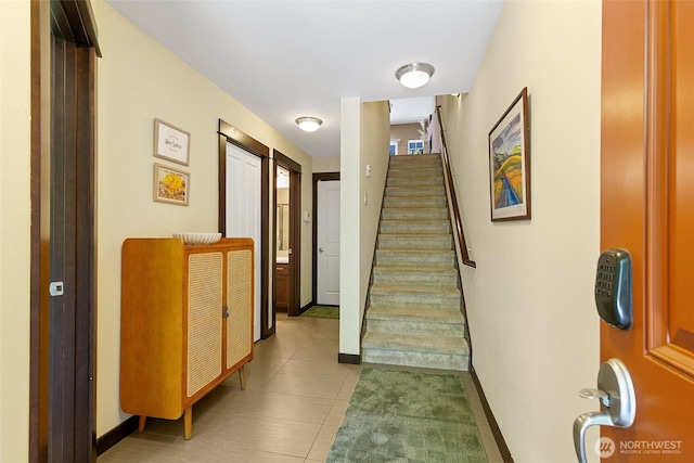 7162 Shinkle Pl SW Unit 64, Seattle, WA 98106 - stairway featuring tile patterned floors and baseboards