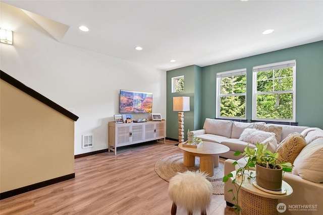 7162 Shinkle Pl SW Unit 64, Seattle, WA 98106 - living room featuring recessed lighting and light wood-style flooring