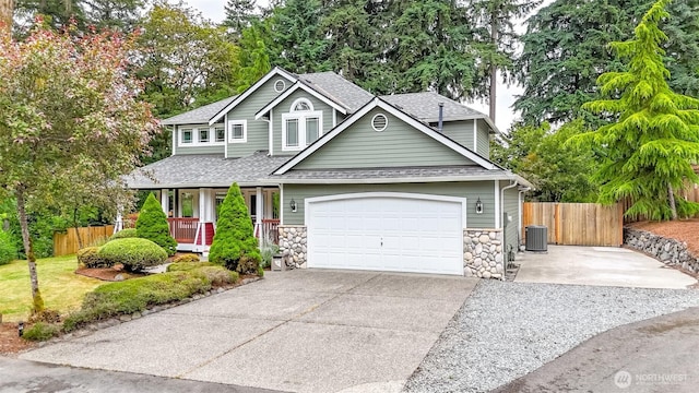 3112 87th Avenue Ct E, Edgewood, WA 98371 - traditional-style home featuring roof with shingles, stone siding, concrete driveway, and a garage