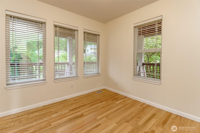 3112 87th Avenue Ct E, Edgewood, WA 98371 - spare room featuring healthy amount of natural light and wood finished floors