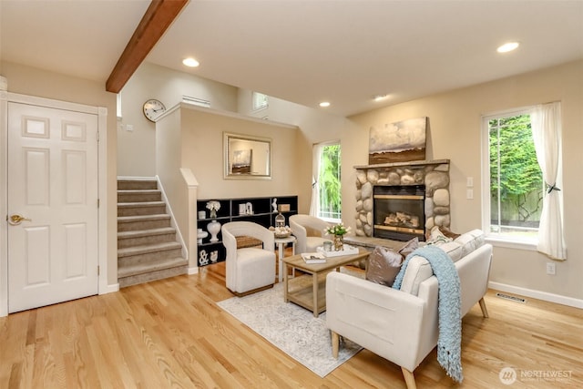 3112 87th Avenue Ct E, Edgewood, WA 98371 - living room featuring stairway, light wood-type flooring, a fireplace, recessed lighting, and beamed ceiling