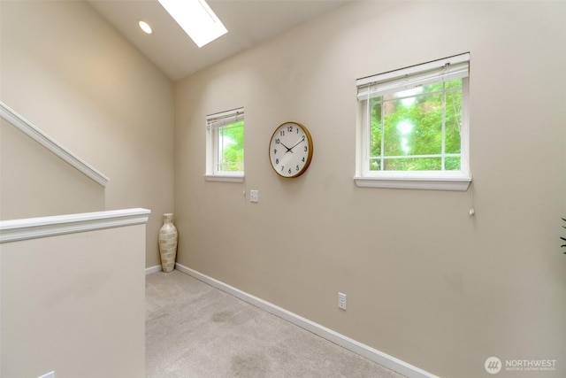 3112 87th Avenue Ct E, Edgewood, WA 98371 - hallway with a skylight, light carpet, and lofted ceiling