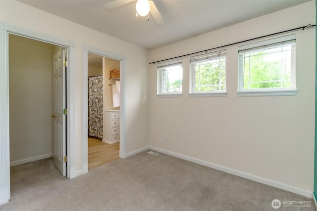 3112 87th Avenue Ct E, Edgewood, WA 98371 - unfurnished bedroom with light carpet and a ceiling fan