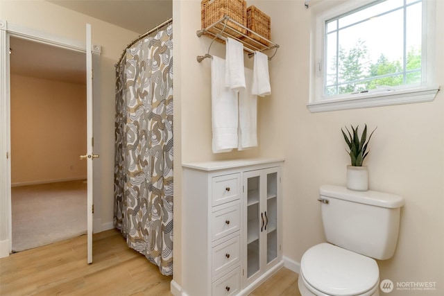3112 87th Avenue Ct E, Edgewood, WA 98371 - bathroom with wood finished floors and a shower with curtain