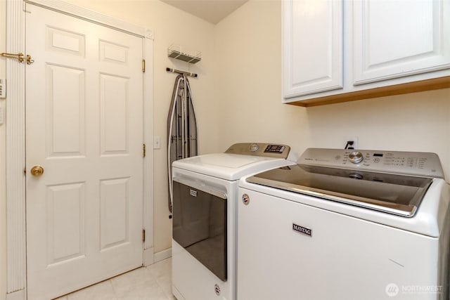 3112 87th Avenue Ct E, Edgewood, WA 98371 - laundry area featuring separate washer and dryer, cabinet space, and light tile patterned floors