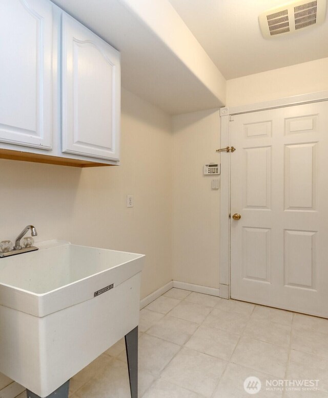 3112 87th Avenue Ct E, Edgewood, WA 98371 - washroom with a sink and light tile patterned floors