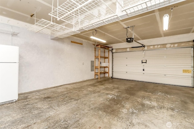 3112 87th Avenue Ct E, Edgewood, WA 98371 - garage with freestanding refrigerator and a garage door opener