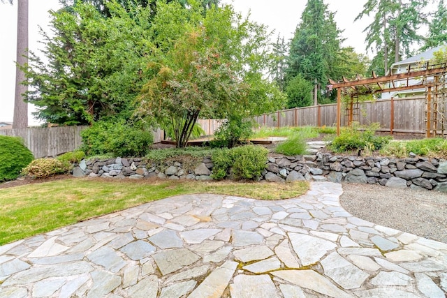 3112 87th Avenue Ct E, Edgewood, WA 98371 - fenced backyard with a patio area