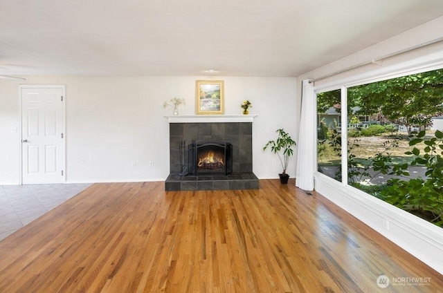 16204 Corliss Pl N, Shoreline, WA 98133 - unfurnished living room with a tile fireplace and wood finished floors