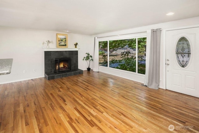 16204 Corliss Pl N, Shoreline, WA 98133 - unfurnished living room featuring wood finished floors and a fireplace