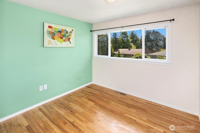 16204 Corliss Pl N, Shoreline, WA 98133 - spare room featuring light wood finished floors and baseboards
