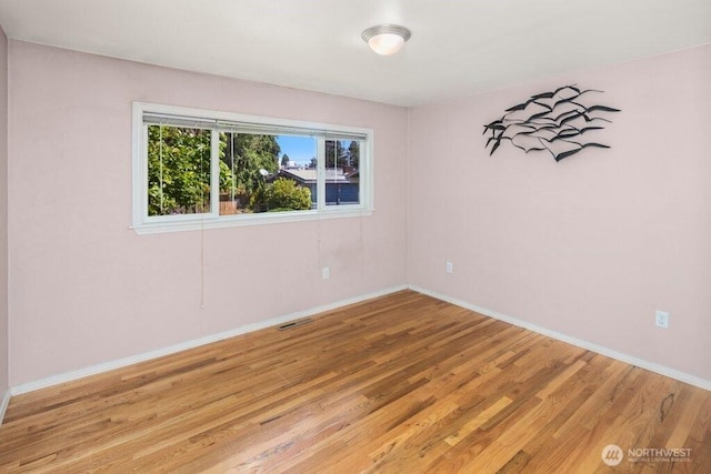 16204 Corliss Pl N, Shoreline, WA 98133 - unfurnished room with light wood-type flooring and baseboards