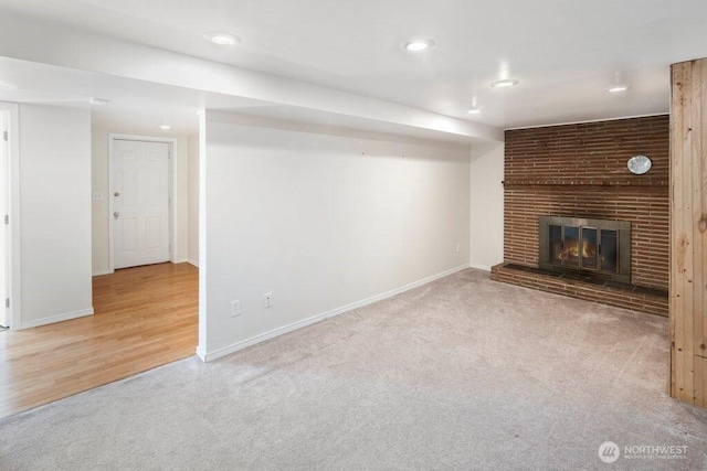 16204 Corliss Pl N, Shoreline, WA 98133 - unfurnished living room featuring carpet floors, a brick fireplace, and recessed lighting