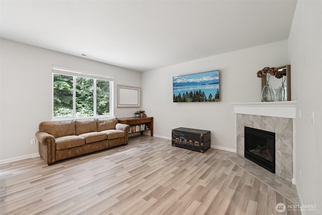 7608 16th Pl SE, Lake Stevens, WA 98258 - living room featuring light wood finished floors and a fireplace