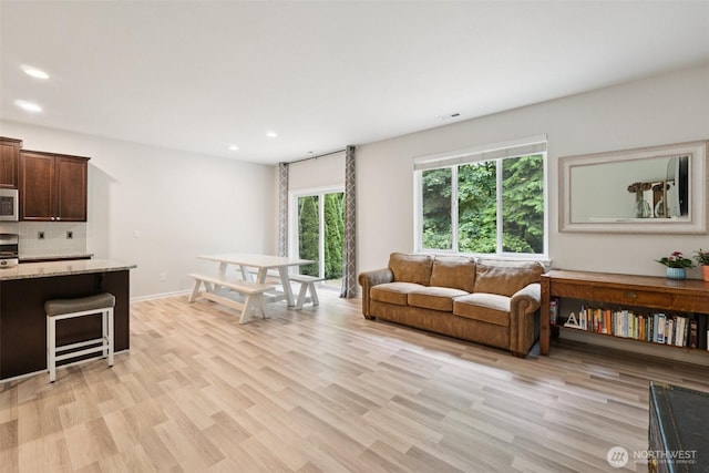 7608 16th Pl SE, Lake Stevens, WA 98258 - living area with recessed lighting and light wood-style flooring