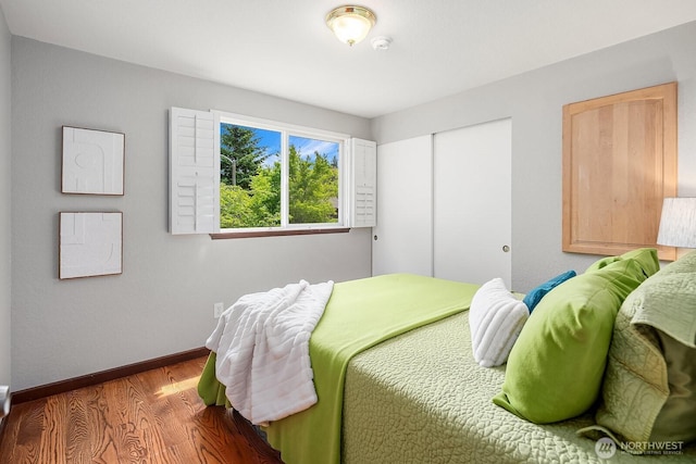 409 169th St SE, Bothell, WA 98012 - bedroom featuring wood finished floors and a closet