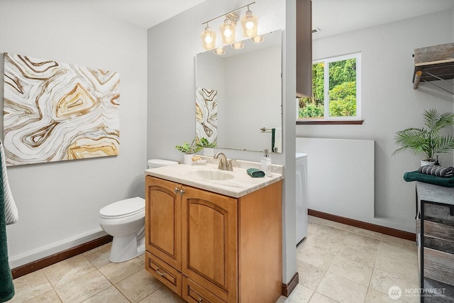 409 169th St SE, Bothell, WA 98012 - bathroom featuring vanity and washer / clothes dryer