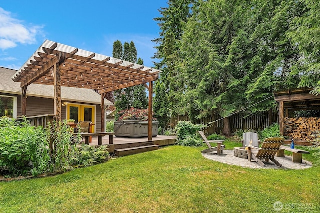 409 169th St SE, Bothell, WA 98012 - view of yard featuring a hot tub, a pergola, an outdoor fire pit, a wooden deck, and a patio area