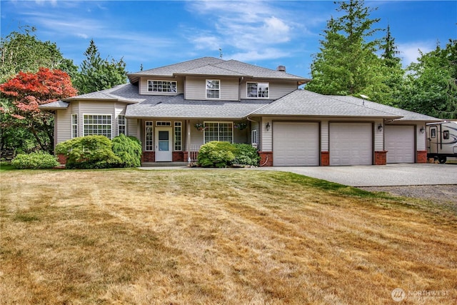 21414 137th Ave NE, Arlington, WA 98223 - view of front facade with an attached garage, driveway, covered porch, and a front lawn