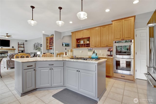 21414 137th Ave NE, Arlington, WA 98223 - kitchen featuring appliances with stainless steel finishes, gray cabinetry, a kitchen island, a ceiling fan, and decorative light fixtures