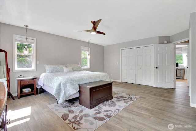 21414 137th Ave NE, Arlington, WA 98223 - bedroom featuring light wood finished floors, a closet, and ceiling fan