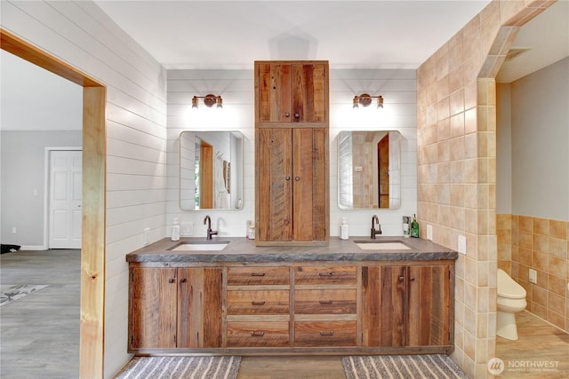 21414 137th Ave NE, Arlington, WA 98223 - bathroom with tile walls, wood finished floors, and double vanity