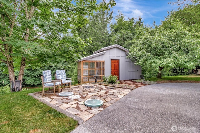 21414 137th Ave NE, Arlington, WA 98223 - view of yard featuring a patio area and an outdoor structure