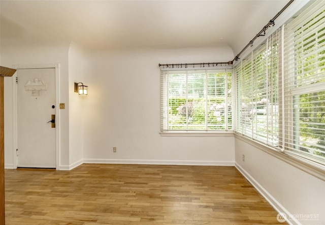 6711 100th St SW, Lakewood, WA 98499 - spare room featuring light wood-style floors and baseboards