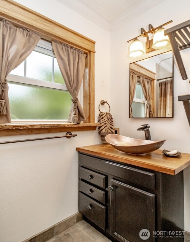 6711 100th St SW, Lakewood, WA 98499 - bathroom featuring vanity and crown molding