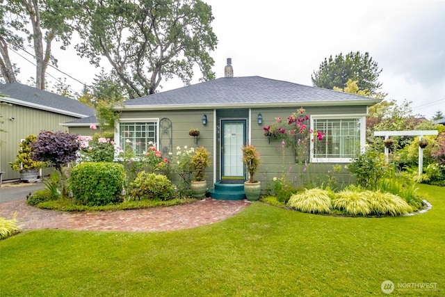 6711 100th St SW, Lakewood, WA 98499 - view of front of home with a chimney and a front yard