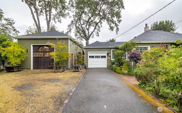 6711 100th St SW, Lakewood, WA 98499 - ranch-style house with an attached garage and asphalt driveway