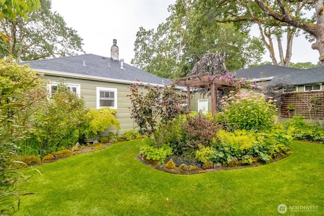 6711 100th St SW, Lakewood, WA 98499 - back of property featuring a chimney and roof with shingles