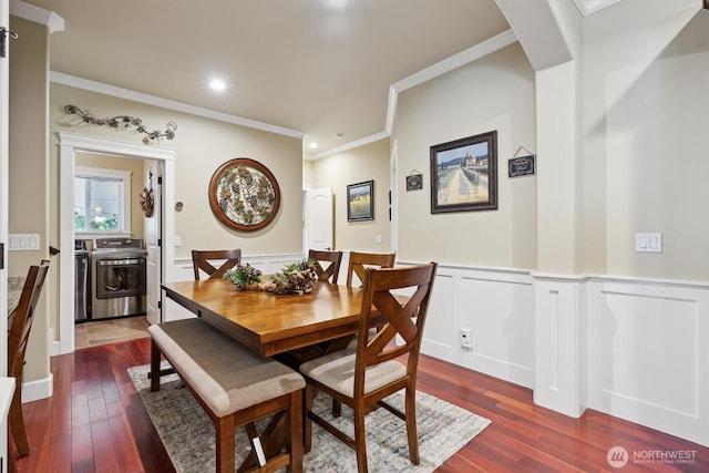 26713 178th Loop SE, Covington, WA 98042 - dining area featuring washer and dryer, ornamental molding, dark wood-style flooring, wainscoting, and recessed lighting