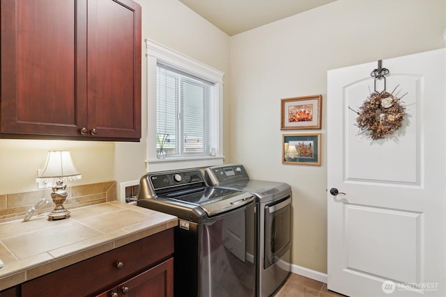 26713 178th Loop SE, Covington, WA 98042 - laundry room with cabinet space, washing machine and dryer, and light tile patterned floors
