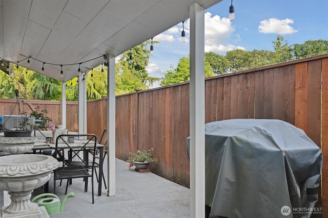 26713 178th Loop SE, Covington, WA 98042 - fenced backyard with grilling area, a patio area, and outdoor dining space