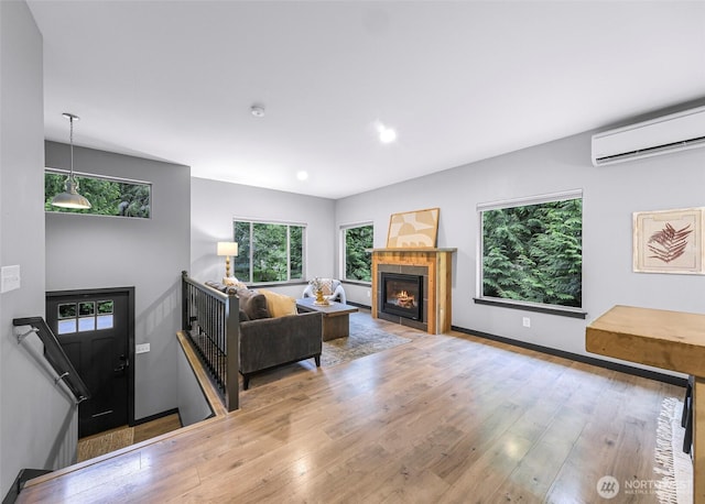 3 River Ridge Loop, Bellingham, WA 98229 - living room with a wall unit AC, wood finished floors, a tile fireplace, and recessed lighting