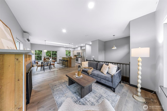 3 River Ridge Loop, Bellingham, WA 98229 - living area featuring a wall mounted air conditioner, light wood-style flooring, a fireplace, and recessed lighting