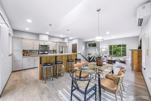 3 River Ridge Loop, Bellingham, WA 98229 - dining area with a wall unit AC, light wood-style flooring, and recessed lighting
