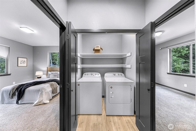 3 River Ridge Loop, Bellingham, WA 98229 - laundry room with washing machine and clothes dryer, light colored carpet, and light wood-type flooring