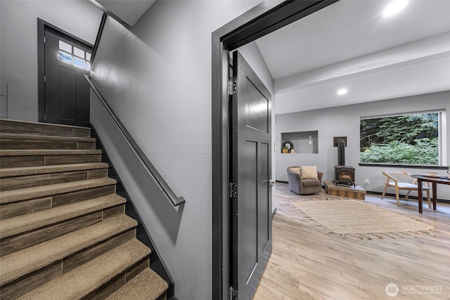 3 River Ridge Loop, Bellingham, WA 98229 - stairway featuring a wood stove, wood finished floors, recessed lighting, and a baseboard radiator