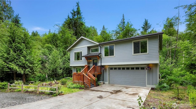3 River Ridge Loop, Bellingham, WA 98229 - raised ranch featuring driveway, an attached garage, and board and batten siding