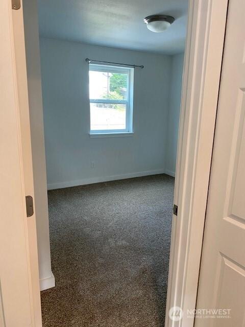 18768 1st Ave NE, Suquamish, WA 98392 - carpeted empty room featuring baseboards