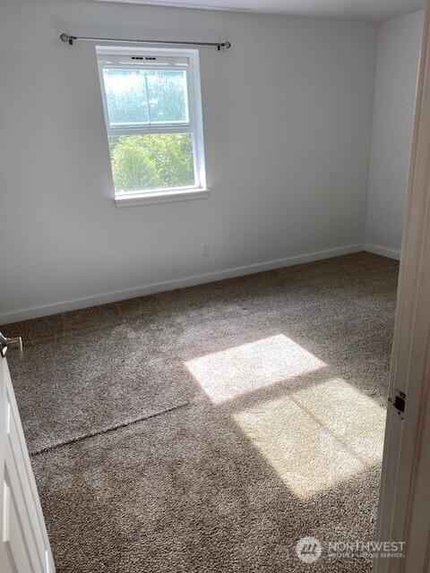18768 1st Ave NE, Suquamish, WA 98392 - empty room with carpet floors and baseboards
