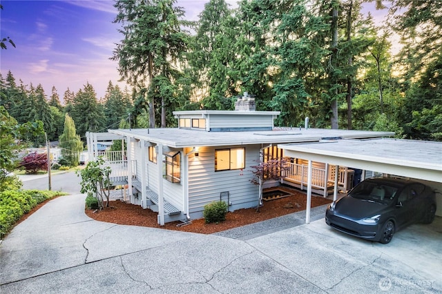830 S 301st Pl, Federal Way, WA 98003 - view of front facade featuring driveway, a chimney, and a carport