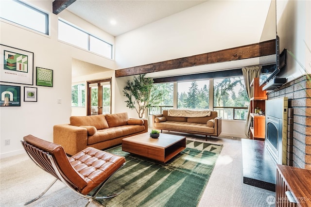 830 S 301st Pl, Federal Way, WA 98003 - carpeted living area with a brick fireplace, plenty of natural light, french doors, a towering ceiling, and recessed lighting