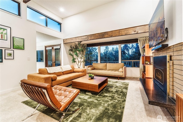 830 S 301st Pl, Federal Way, WA 98003 - living area with a high ceiling, a fireplace, carpet floors, and french doors